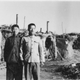 Shan (left)and a friend in front of a self-built reed-and-mud hut by Lake Wuliangsu in Inner Mongolia, sometime in the winter of 1970-1971.